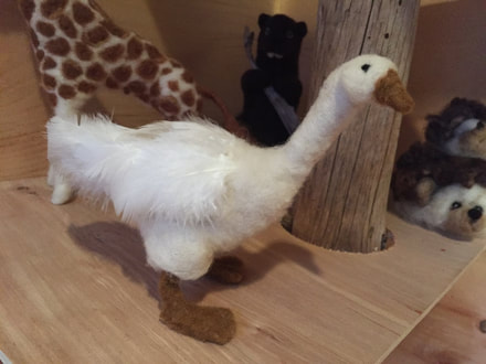 Customer appreciation photo of a felted white goose using feathers from Running Bug Farm.