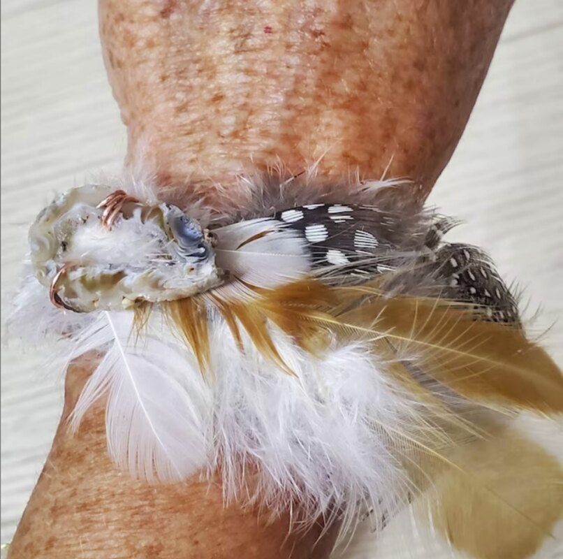 Postive customer picture review of humane feathers from running bug farm usa. Bracelet with geode crystal and copper.