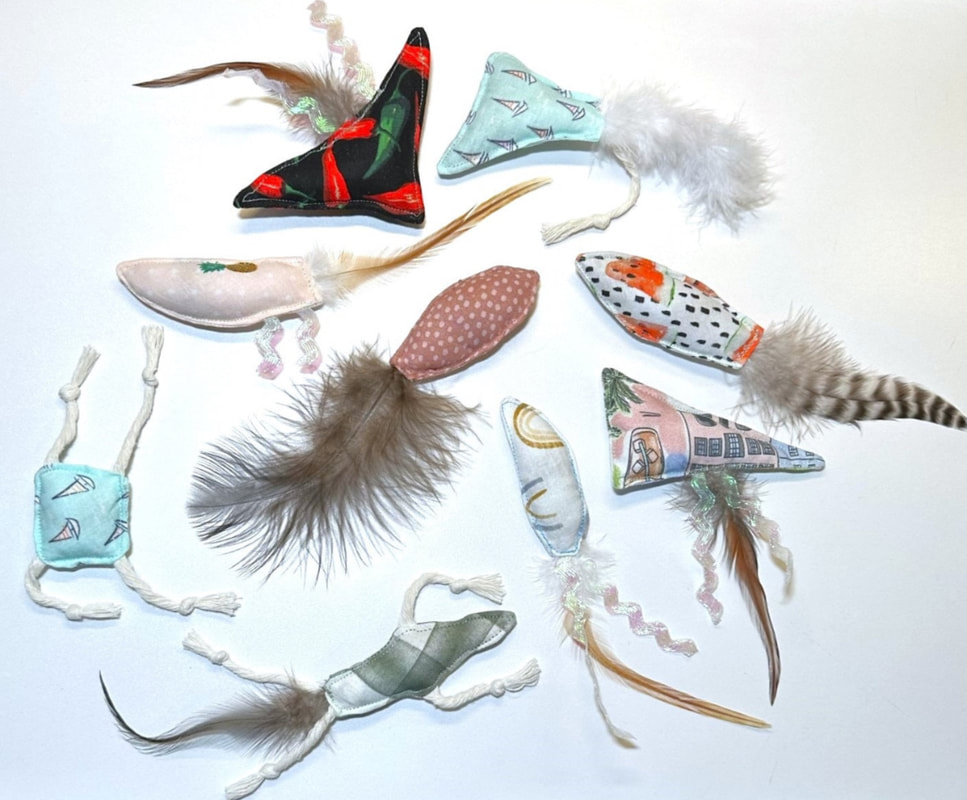 Customer picture of hand made cat toys using feathers from Running Bug Farm Better Than Organic USA