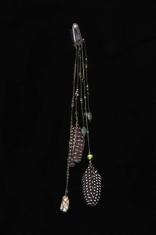 Another creation from one of your beautiful cruelty free feathers! A feather and gemstone hairclip with adventurine beads and moonstone gem encased in handknotted net.  Glass and crystal beads add extra sparkle.  Customer review with an appreciation photo for Running Bug Farm.