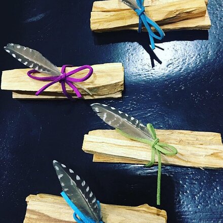 Picture of guinea fowl wing feathers with long quills from Running Bug Farm used by a customer to make Palo Santo bundles.