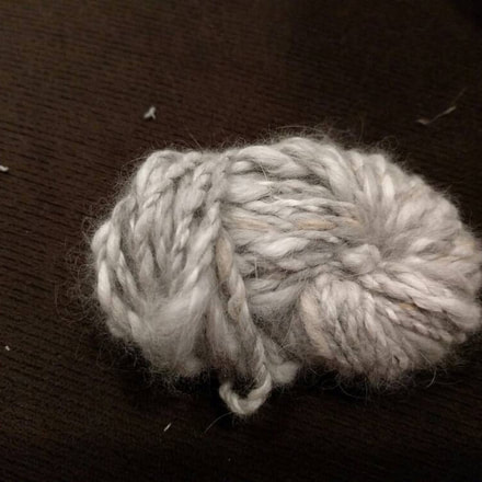     This is amazingly soft! It's a little tricky to start spinning on its own, but with a little      practice, I made some lovely two ply yarn. It's surprisingly strong once it's spun and SO SOFT!  Review of Running Bug Farm.