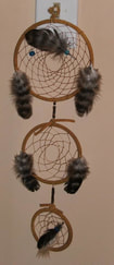 Customer photo of a dream catcher made using real feathers from Running Bug Farm.