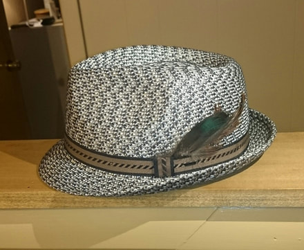 Customer appreciation photo of feather hat.  Running Bug Farm.