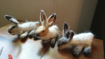   Fibers are perfectly clean and a gorgeous, pure white!  A beautiful blend of greys. Very soft!   So soft, lovely tort color!  Customer photo of needle felted rabbits using Running Bug Farm's Mixed Angora Rabbit Wool.