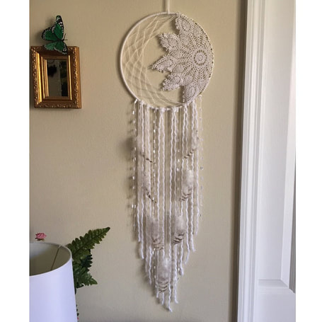 Created this sun and moon dreamcatcher with the feathers. All the feathers are in perfect condition thank you so much! I will be shopping again very soon :)!  Feather review.  Running Bug Farm.